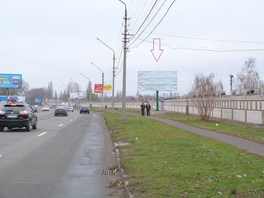 Щит 6x3,  ул. Московская, перекрёсток с ул. Л.Украинки, возле офисного центра «Каскад», район Оптового продуктового рынка, поворот к Строительному рынку