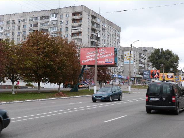 Щит 6x3,  просп. Свободы (ул.60л.Октября), 2, кварт. 101, перекр. с ул. Европейской (Щорса), район магазина «Эврика» и супермаркета «Оптовичёк»